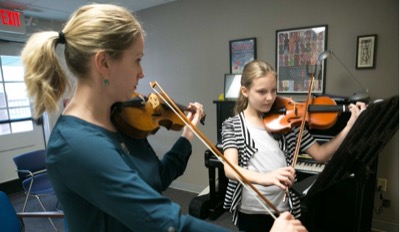 two students playing viola